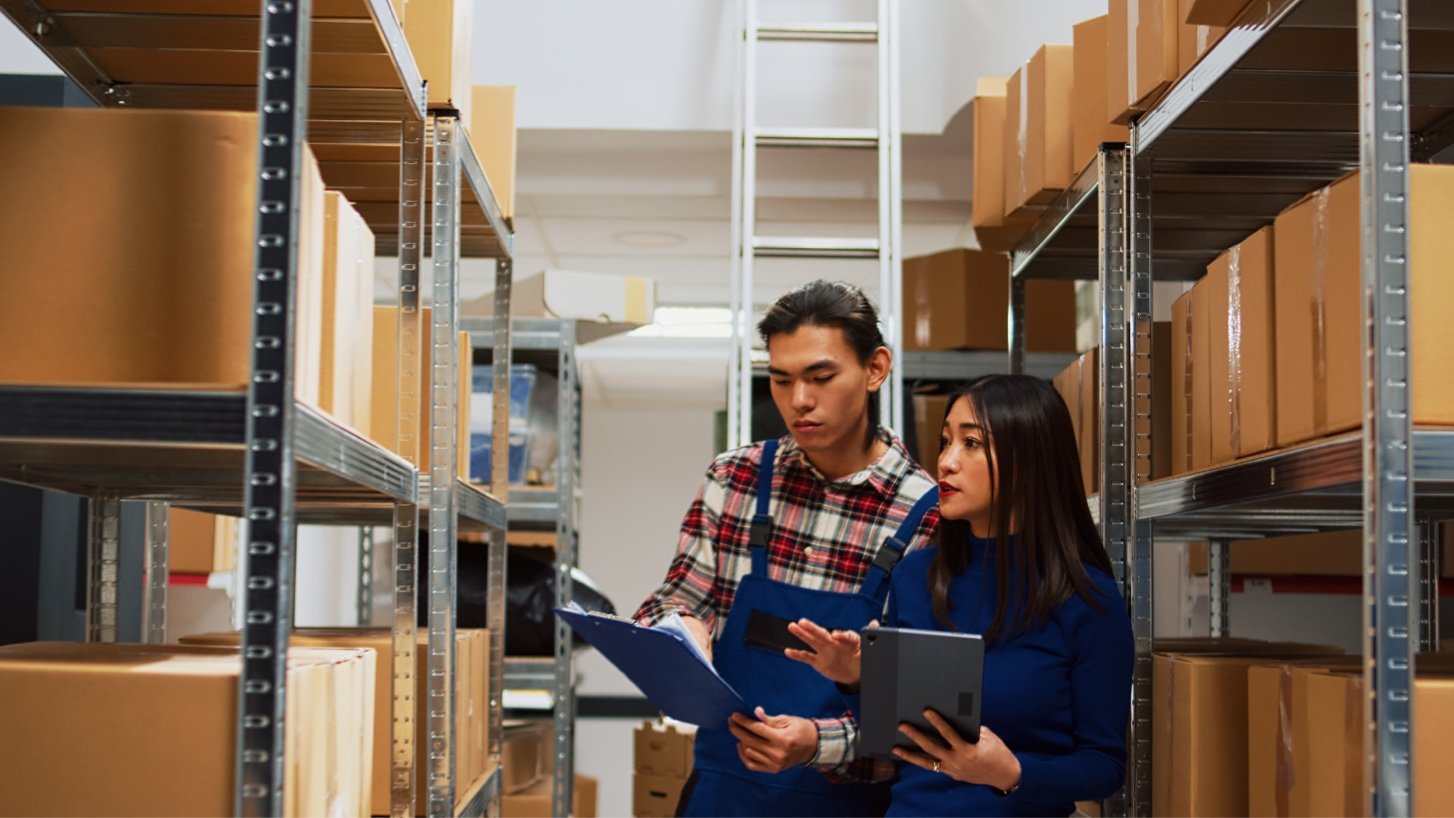 Two retail workers in a warehouse