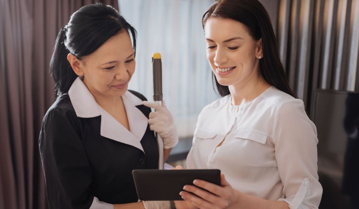 Hotel staff looking at a tablet